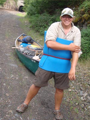 Dragging canoe portage.