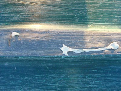Patching holes in canoe.