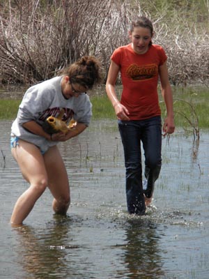 Girls holding on to hand caught carp.