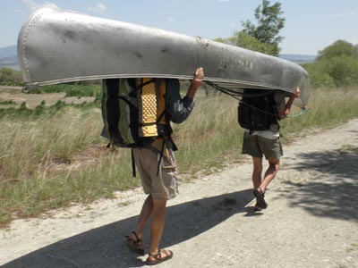 Portaging a canoe.