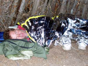 Camping with space blanket.
